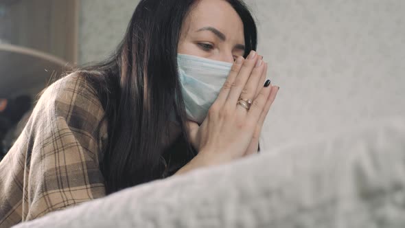 Young Woman in Protective Mask with Praying Hands Asks God for Healing Recovery During Disease
