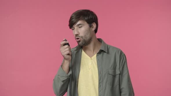 Seriouslooking Busy Handsome Bearded Guy Employee Dispatcher Talking Via Radio Set Confirm