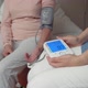 Detail of Automatic Arm Blood Pressure Monitor With High Blood Pressure on Blue Display - VideoHive Item for Sale