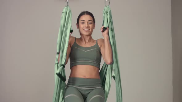 Adorable Woman Yoga Trainer During Aerial Yoga Master Class 