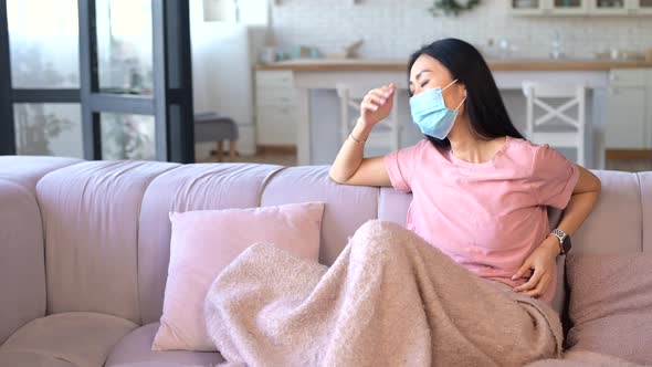 An Young Asian Woman Wearing Mask Isolated at Home