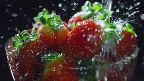 Splashing Water on Red Strawberries