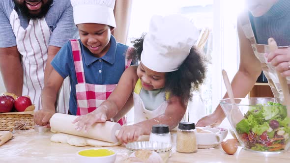 Funny moment of Happy African American family and cooking together