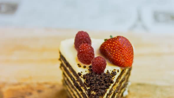 A Slice of Strawberry and Raspberry Cake and Slices Pressed with Chocolate