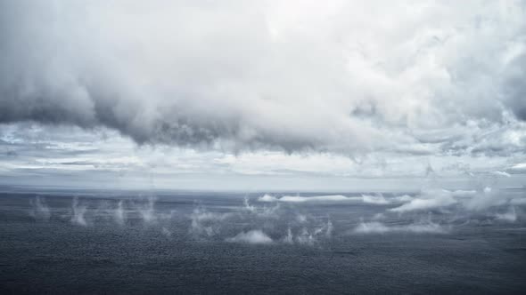 Timelapse Aerial Video of the Deep Sea and Fog in the Sky