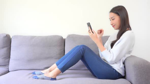 Young asian woman use smart phone