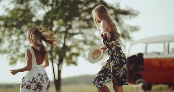 Two Young Female Dancing in the Middle of Nature
