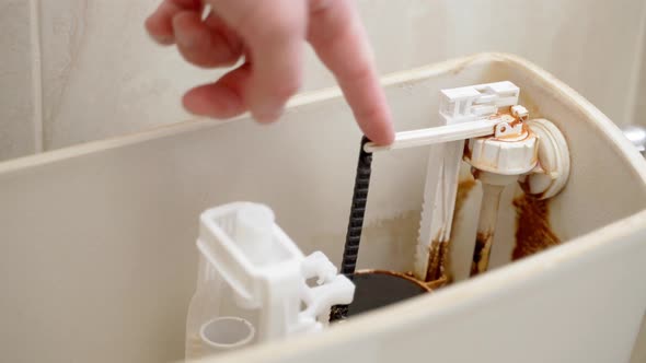 Finger Pressing Checks the Performance of the Float Valve of the Toilet Bowl