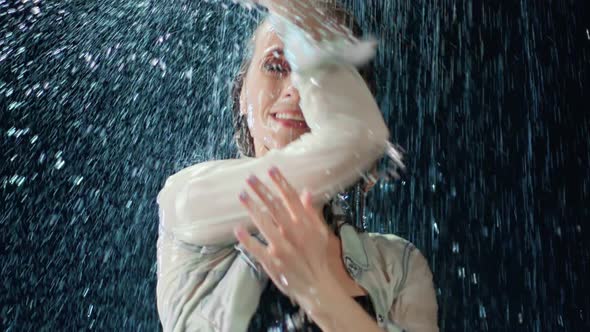 Pleasant Dancer Woman Showing Perfect Slim Body Under Rain