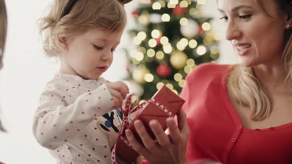 Video of little girl with Christmas present on Christmas morning