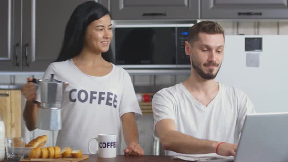 Joyous Woman Serving Coffee for Husband on Breakfast