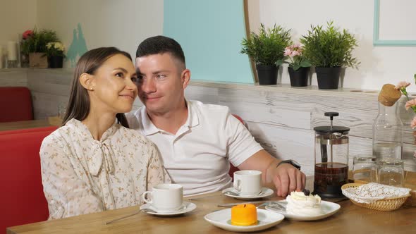 Lovely Couple Drinks Tea Having Date in Confectionery Shop