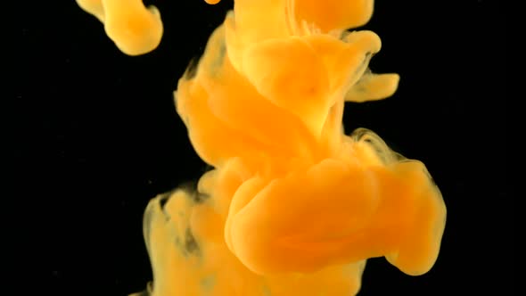 Orange ink dropped in water, Slow Motion alt