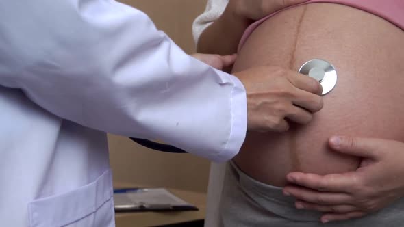 Pregnant Woman and Gynecologist Doctor at Hospital