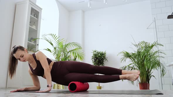 Young Woman Stretch Body on Fitness Mat