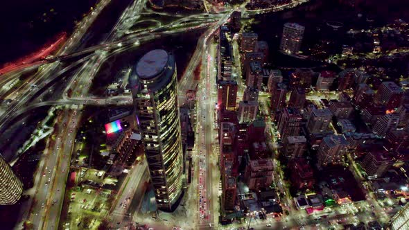 Aerial view dolly in of Vitacura Avenue at night with traffic, Santiago, Chile