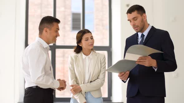 Realtor with Folder Showing Documents To Customers 7