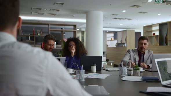 Multiracial Colleagues Team Working Together Brainstorm Business Ideas in Office