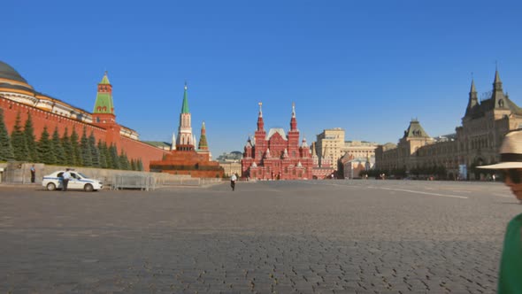 Beautiful tourist walking along the Red Square