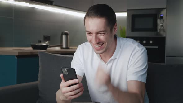 Amazed Happy Young Man Receiving Good News