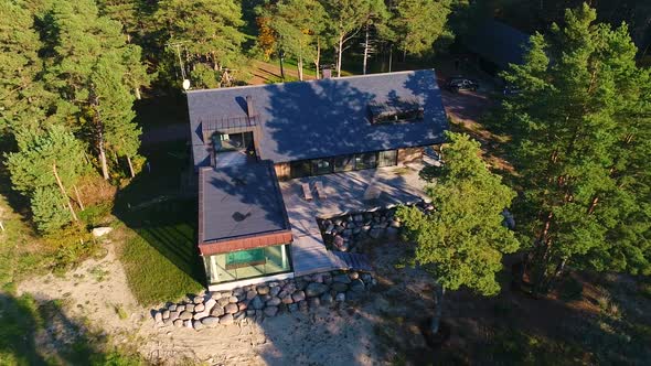 Aerial view of a beautiful residence in the middle of a forest, Estonia.