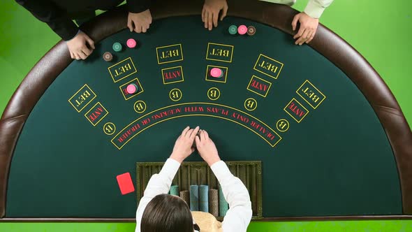 Two Players Play the Poker in Casino Over the Green Table. Green Screen. Top View