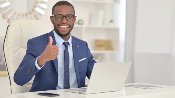Positive African Businessman with Laptop Showing Thumbs Up 