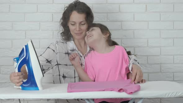 The family is ironing clothes.