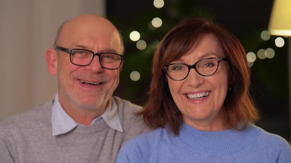 Portrait of Happy Senior Couple at Home in Evening