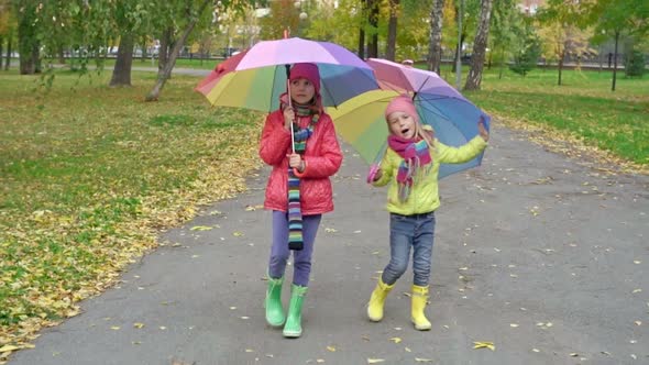 Girls with Umbrellas Singing and Dancing in Park