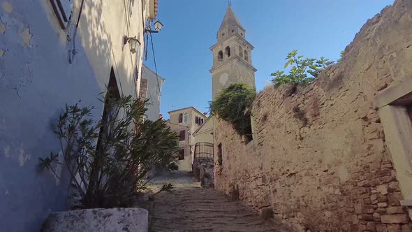 Hand-held video of a walk through the historic center of the Croatian town of Motovun during the day