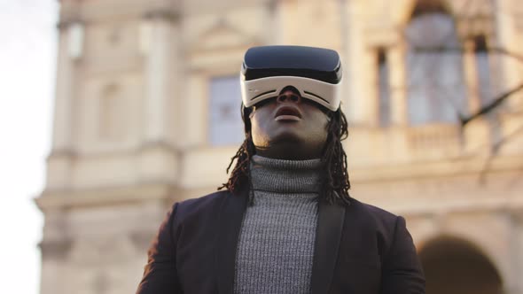 African American Black Man Wearing VR Headset in the Park