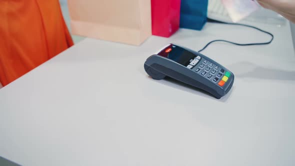 Woman Hand with Credit Card Swipe Through Terminal for Sale