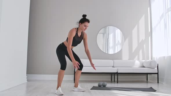 Beautiful Slim Woman in Thirties with Fair Complexion Does Morning Strenth and Aerobic Burpee