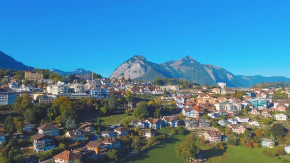 Aerial view of city on hilly landside in Spiez Switzerland for tourism travel ideas in Europe