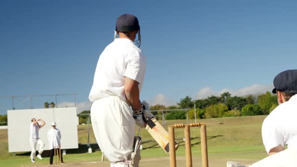 Bowler delivering ball during cricket match