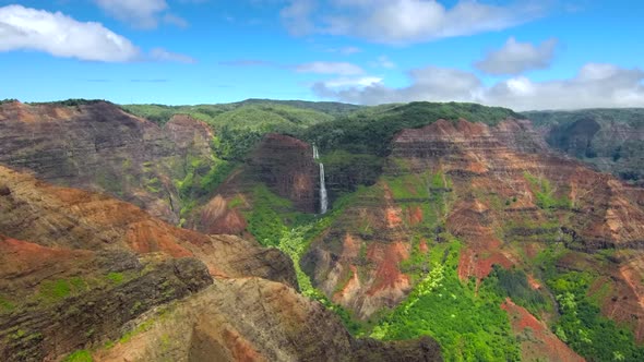 Aerial view of jurssic falls at Waimea Canyon In Kauai Island