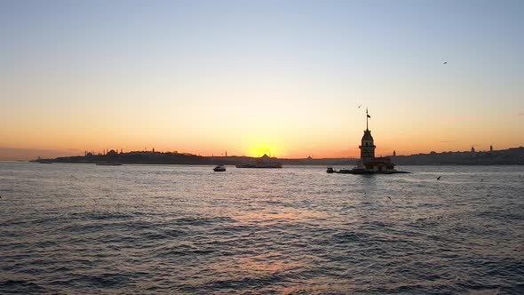 Sunset, sea and historical maiden tower from Istanbul Üsküdar beach