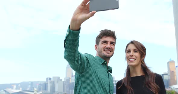 Tourist visit Hong Kong and taking selfie on mobile phone