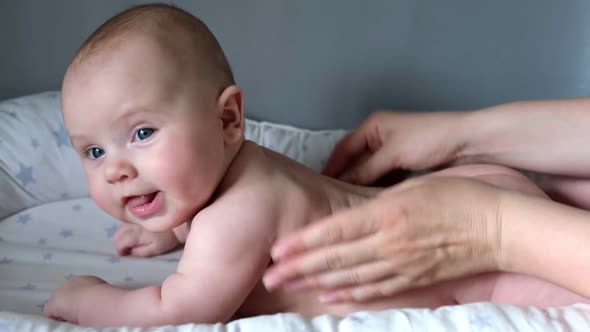 Mother Giving Massage To Little Child