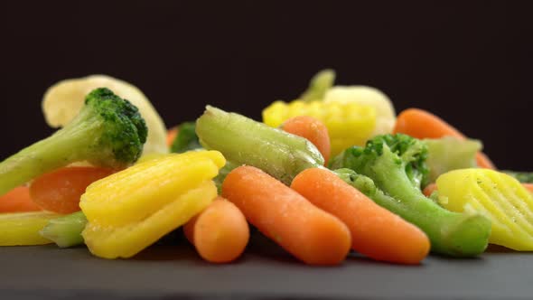 Fresh Frozen Vegetables Rotating on Black Background Healthy Food or Diet Food for Vegetarians and