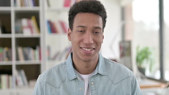 Smiling Young African American Man Looking at the Camera