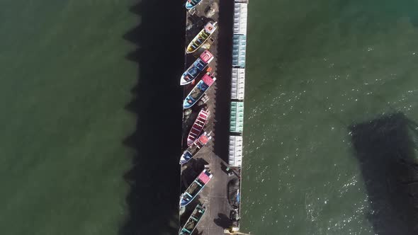 Boats And Restaurant On Puerto Maguillines In Constitucion, Maule, Chile At Summer. aerial top-down