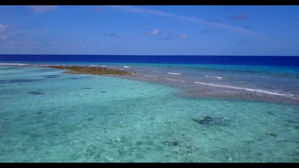 Aerial above scenery of exotic sea view beach holiday by aqua blue lagoon with bright sandy backgrou