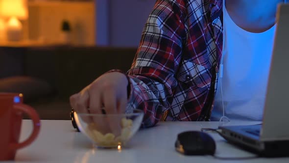 Irritable School Boy Watching Online Competition on Laptop at Night, Addiction