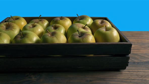 Apples In Crate Moving Shot Bluescreen Isolated
