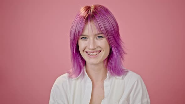 Purplehaired Woman Enjoys Life Smiling and Laughing