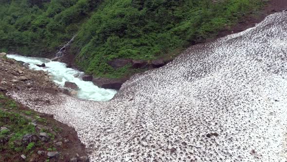 River Flowing Under the Avalanche Mass