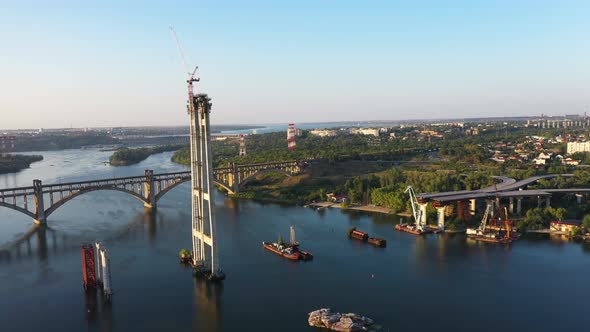 Incomplete Automobile Bridge and Arch Bridge in the Background of Hydroelectric Power Station