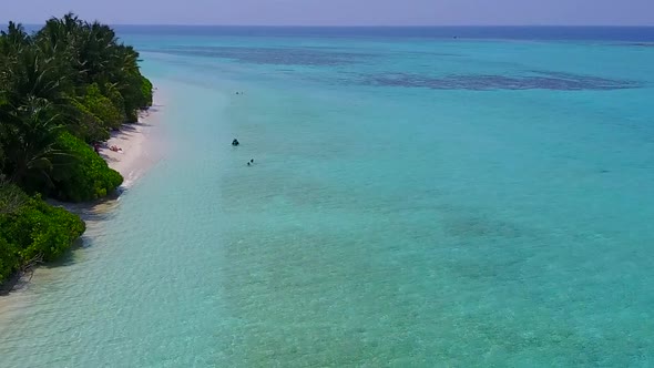 Aerial nature of island beach break by ocean and sand background